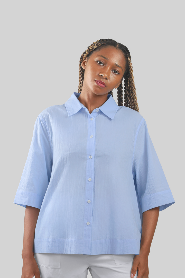 MULHER-CAMISA AZUL NOVA 2026