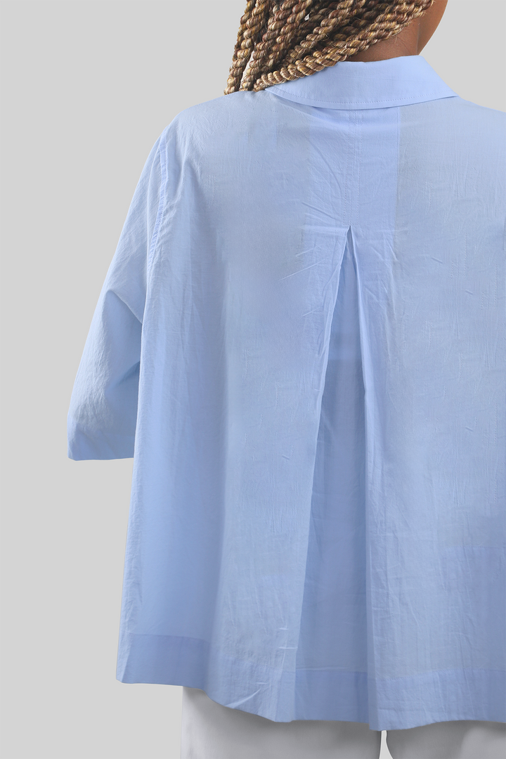 MULHER-CAMISA AZUL NOVA 2026